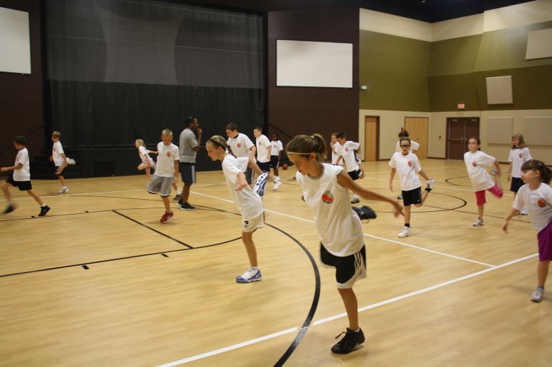 Danielle McCray teaching young athletes at a basketball training camp Danielle McCray teaching young athletes at a basketball training camp